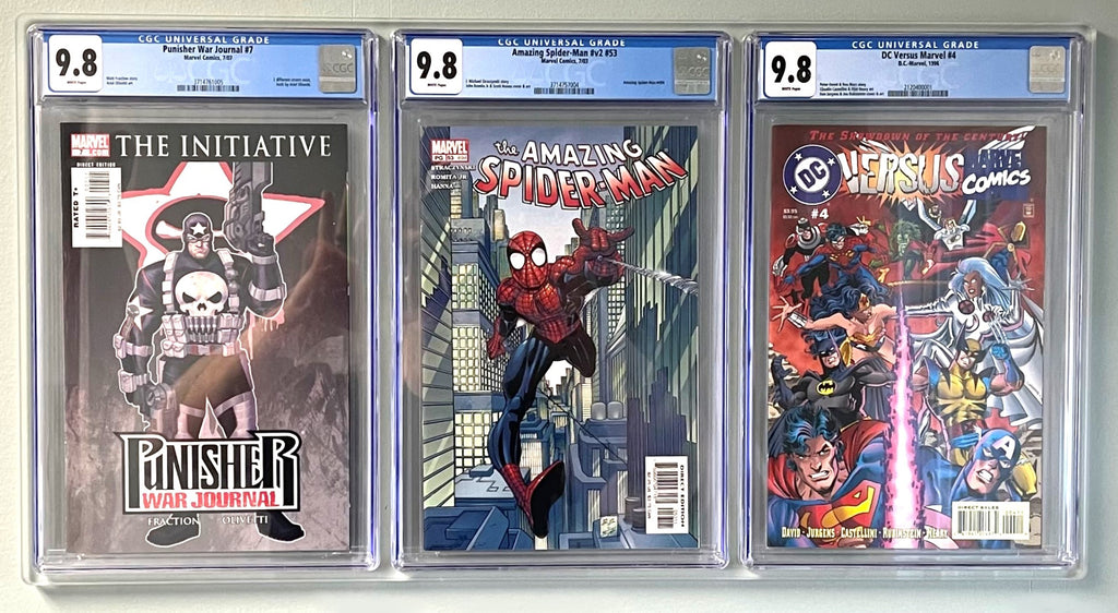 Filled 1x3 comic book wall display with CGC graded comics of the punisher, spiderman, and dc vs marvel